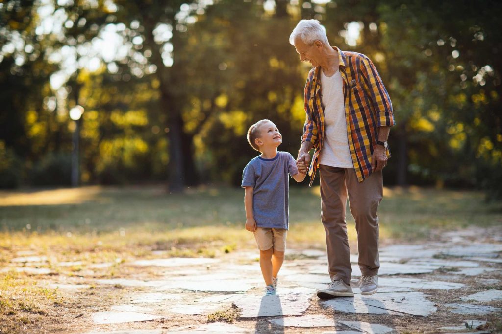 Grandfather and grandson enjoying a walk together