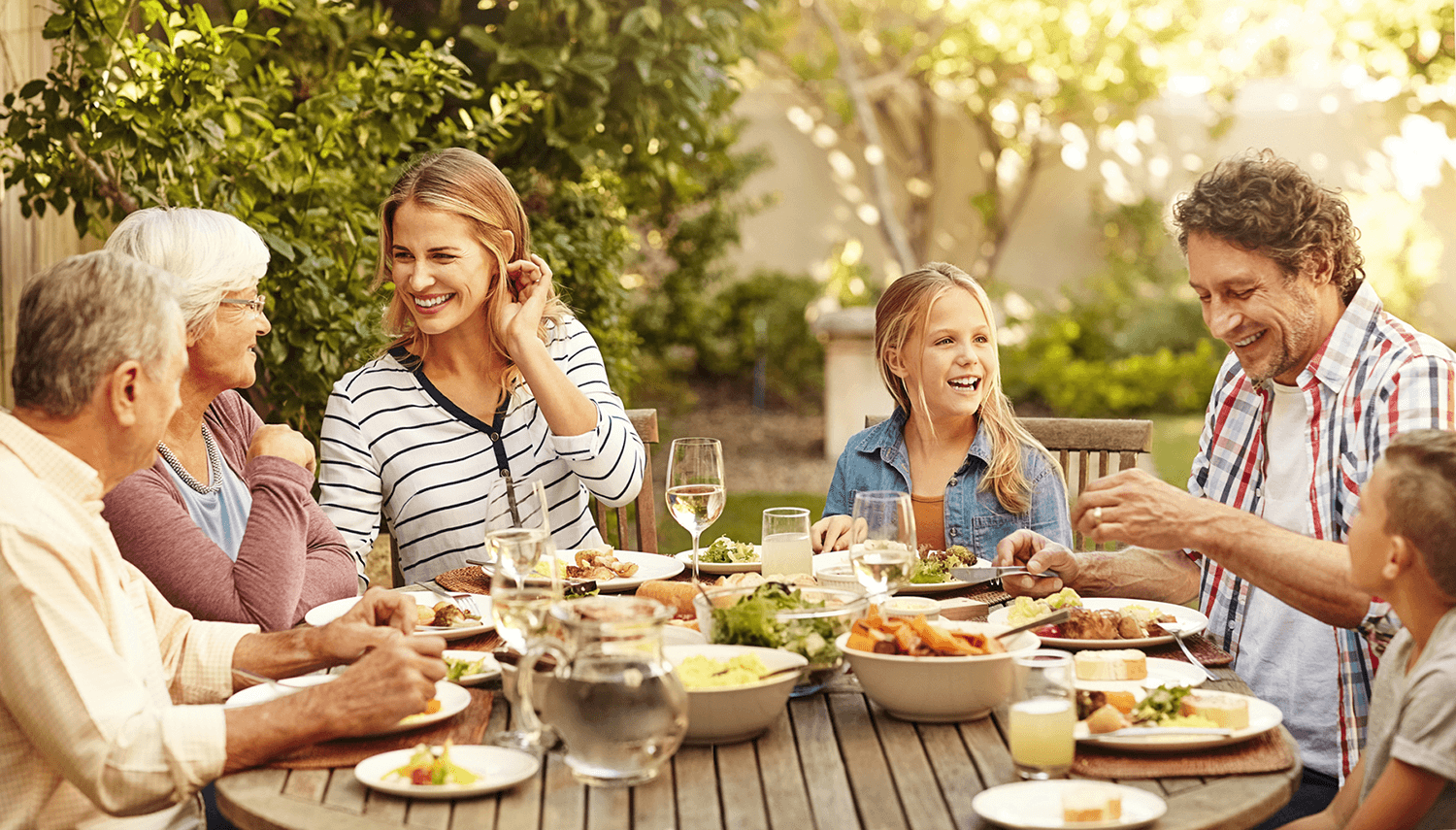 Family enjoying conversation together during dinner